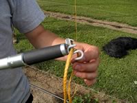 Looping the twine over the bottom of the S-hook