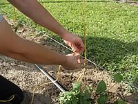 Jason tying off the first end of the twine on to the wire
